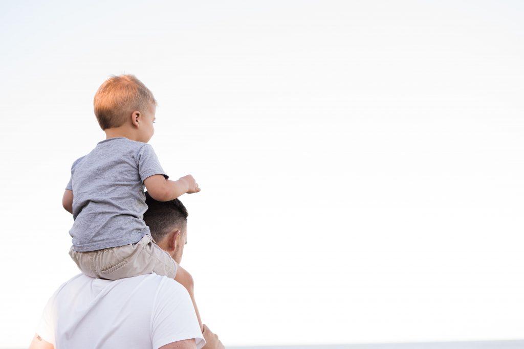 Father giving his son a piggy back - common child custody arrangements - melbourne law studio